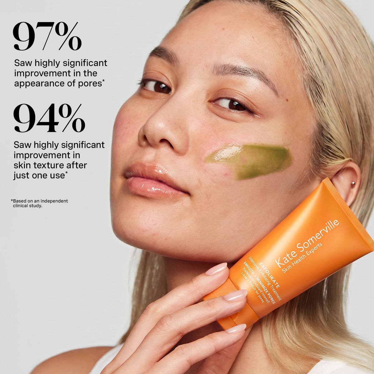 Model holding ExfoliKate Intensive: 97% saw improved appearance of pores, 94% smoother texture after one use*