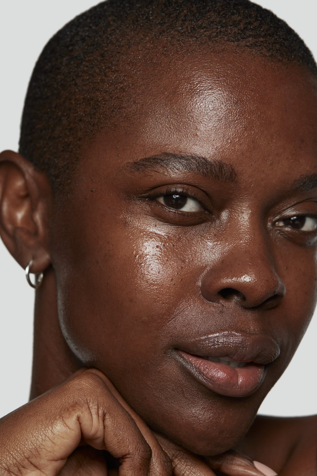 Model with glowing, healthy-looking skin after KateCeuticals SuperCell Rejuvenation Serum